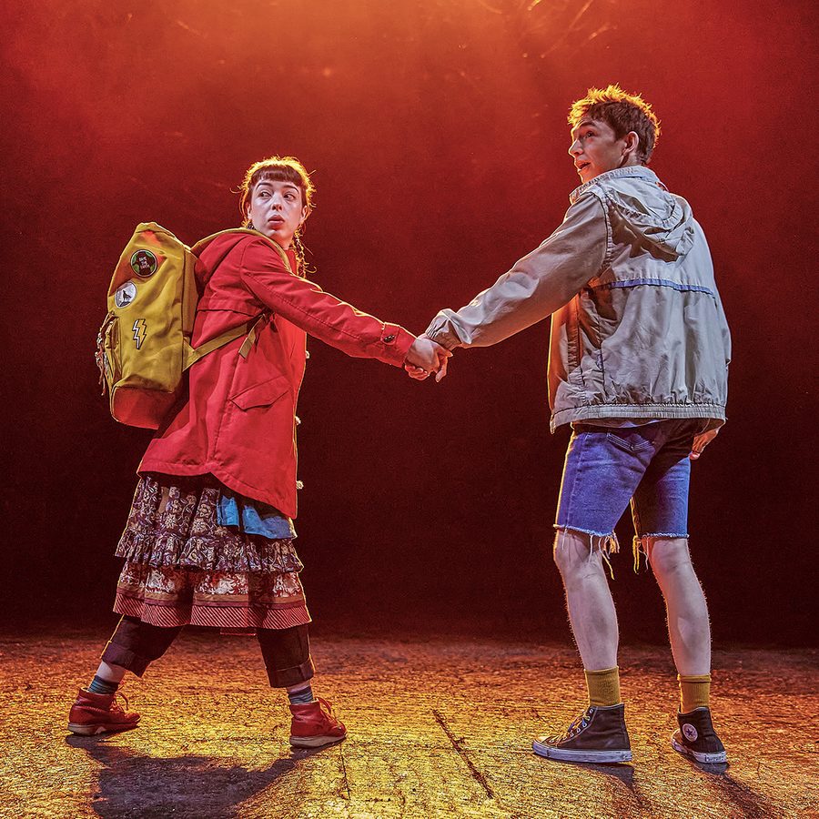 The-Ocean-At-The-End-Of-The-Lane-2000x1250-West-End-cast-at-The-Duke-Of-Yorks-Theatre-_0000s_0001_1039-097.cBrinkhoff-_1996x998_acf_cropped Two people holding hands turning back to look at something behind them