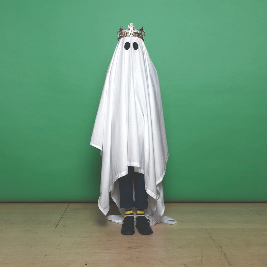 Hamlet - a figure wearing a white sheet with black circles for eyes, like a ghost, and a gold crown.