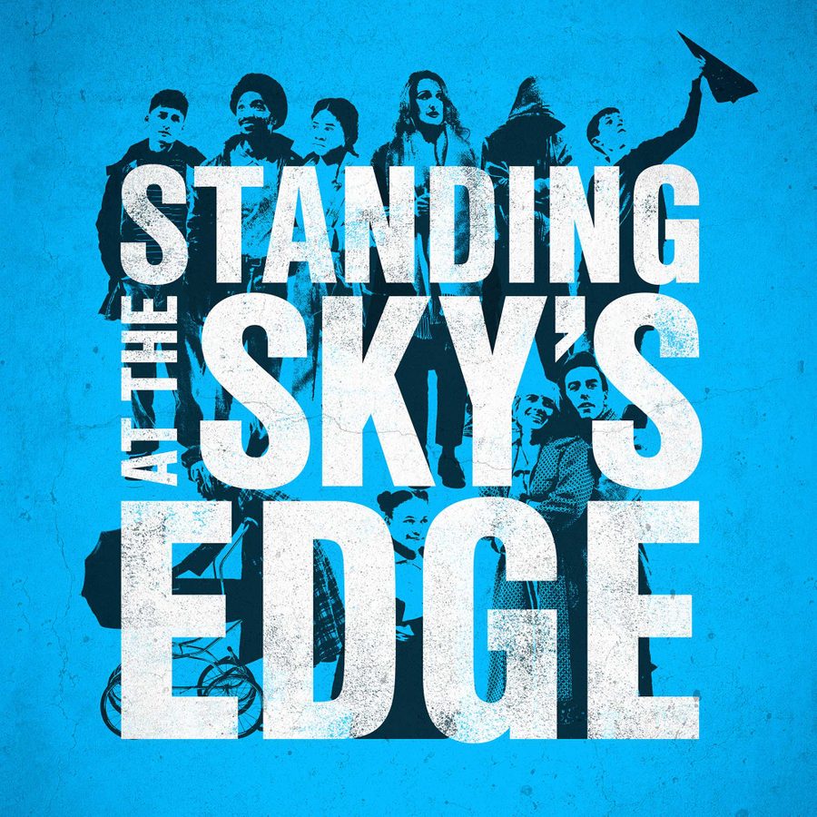 Standing-at-the-Skys-Edge-West-End-masthead3 A collage of standing figures in black, on a blue background, with the show title, Standing at the Sky's Edge, in white capital lettering, superimposed on them